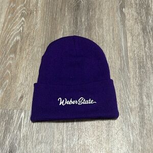 Brand is Port and Company , 100% acrylic , color purple with white lettering